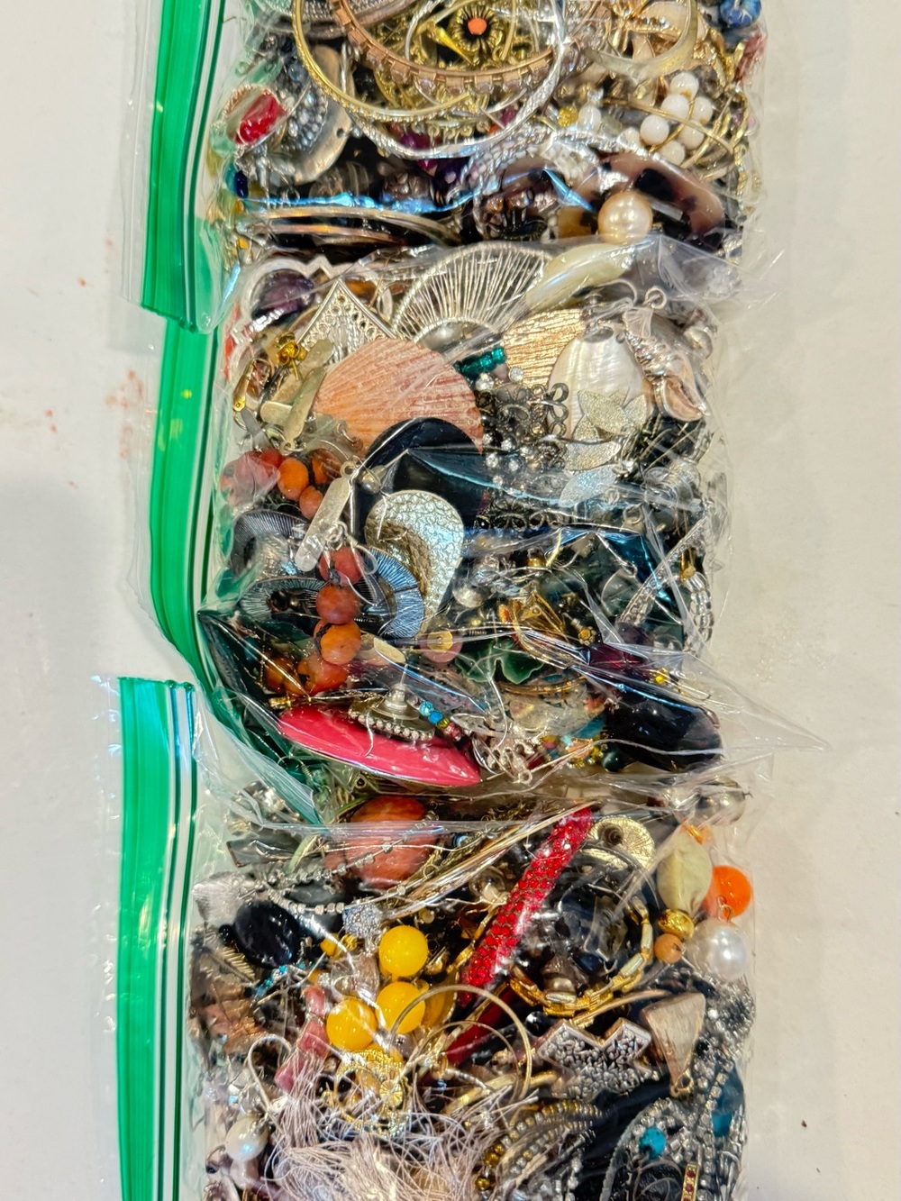 3.62 Pounds of Unchecked Single and a few pairs of earrings.